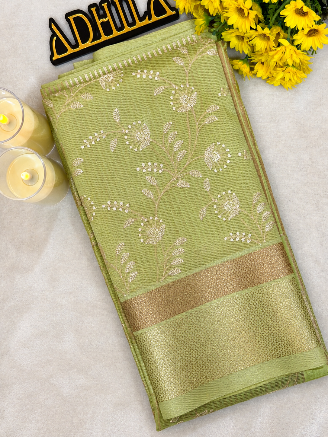 Pistachio Green Floral Tissue Saree – folded view showing intricate floral Jaal work