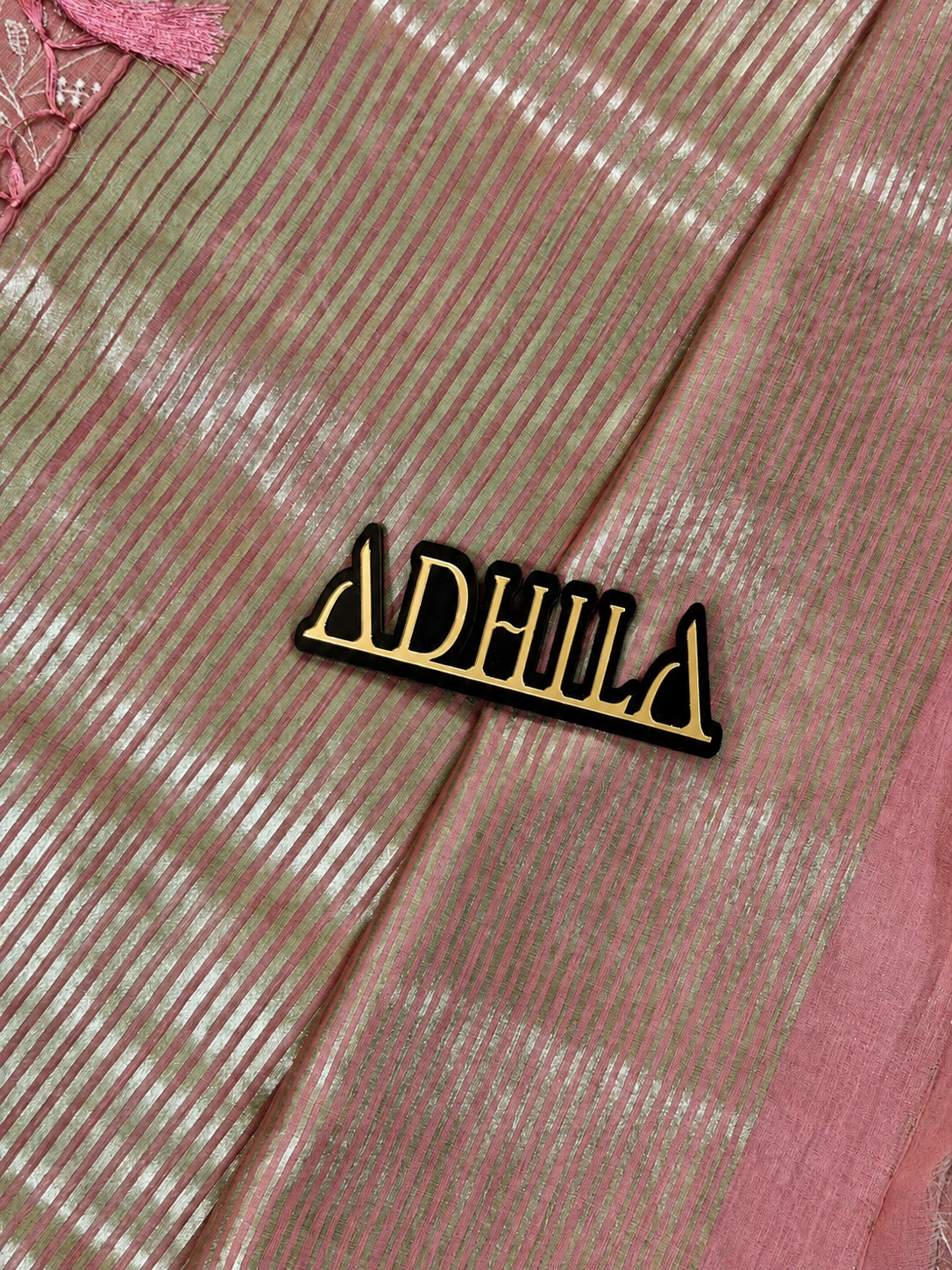 Dusty Rose Pink Floral Tissue Saree – close-up of fabric texture with Adhila logo