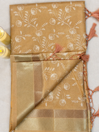 Terracotta Orange Floral Tissue Saree – border and pallu detail with tassel finish