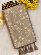 Grey Floral Tissue Saree – folded view showing floral Jaal work and coordinated grey tassels