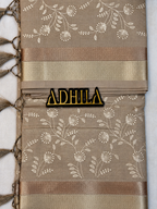 Grey Floral Tissue Saree – unfolded view showing zari border and Adhila logo