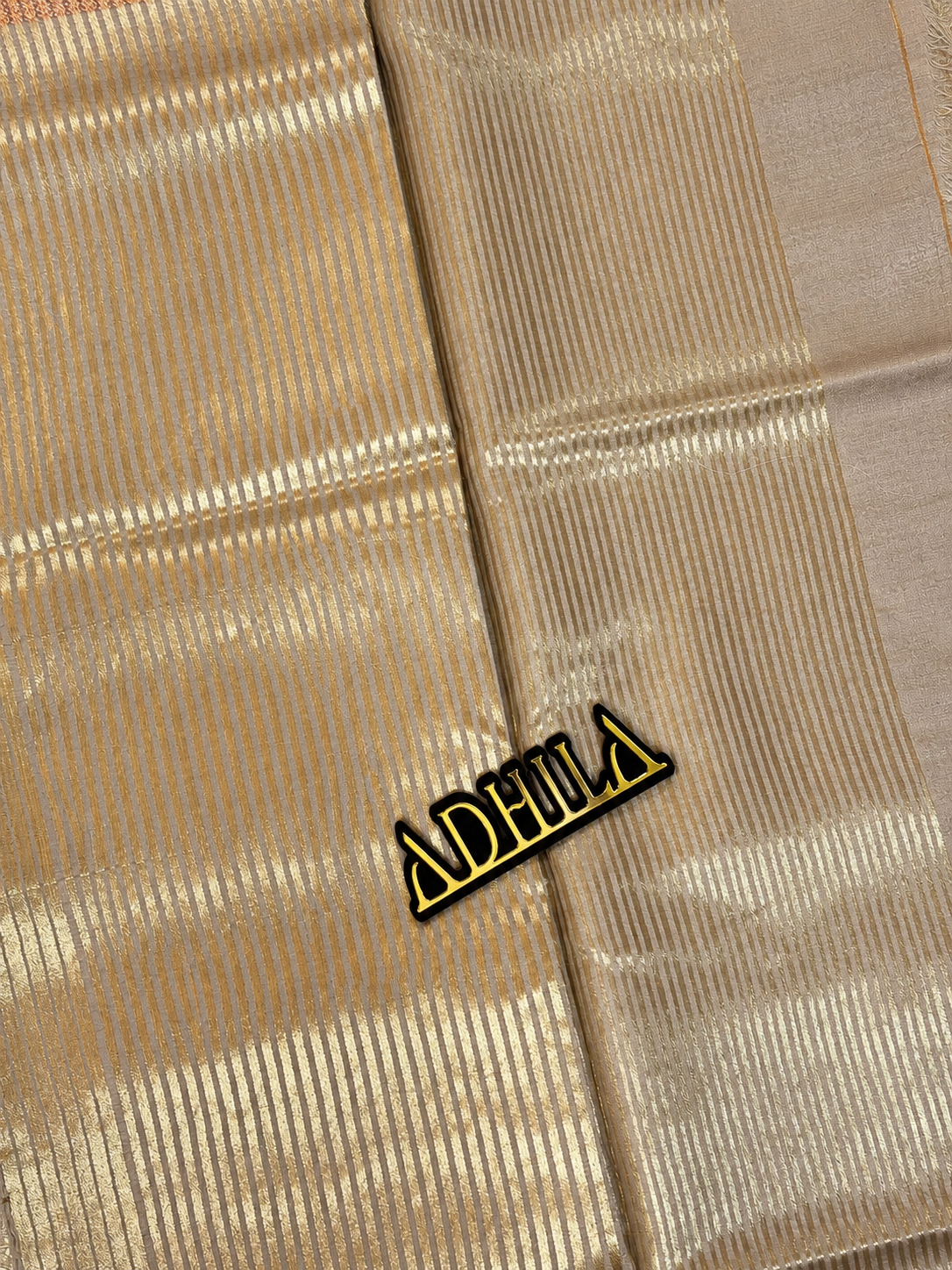 Grey Floral Tissue Saree – close-up of zari striped pallu with Adhila logo